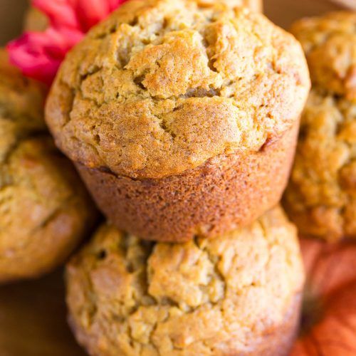 several muffins stacked on top of each other with a flower in the middle