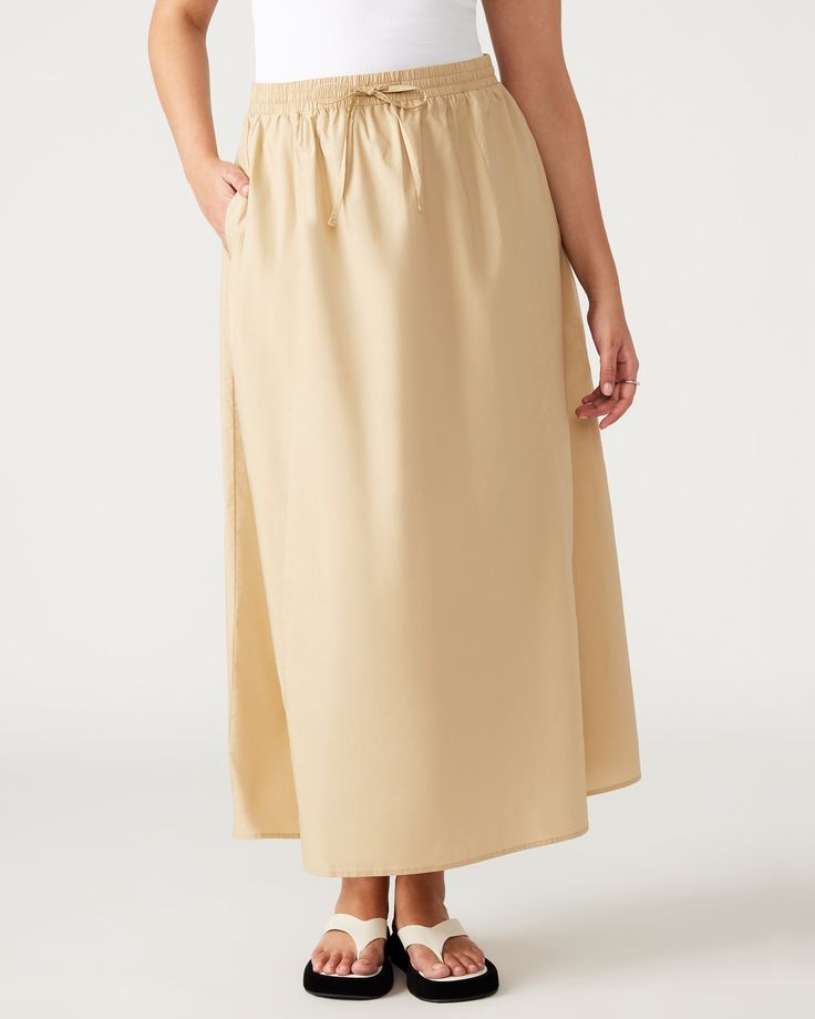 The SUNNY skirt features a comfortable elastic waistband, front tie, and convenient side pockets. This maxi length A-line skirt is perfect for both casual outings and dressier occasions. A-line maxi skirt Elastic waistband with front tie Two functional side pockets Length: 37.25" 100% cotton Hand wash Shop the set here Maelyn is 5ft 11.5in and is wearing a size small Stephanie is 5ft 10in and is wearing a size large Imported Casual Daywear Maxi Skirt With Gathered Waist, Casual Maxi Skirt With Gathered Waist For Daywear, Spring Vacation Maxi Skirt With Drawstring, Relaxed Maxi Skirt With Elastic Waistband For Vacation, Vacation Maxi Skirt With Elastic Waistband, Solid Wide Leg Maxi Skirt For Vacation, Casual Summer Maxi Skirt With Gathered Waist, Casual Flared Maxi Skirt With Gathered Waist, Casual Flowy Maxi Skirt With Gathered Waist