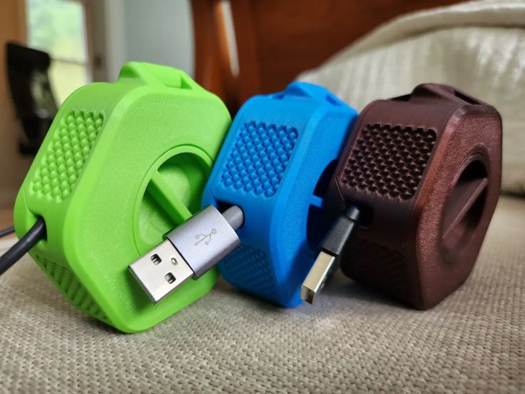 three different colored usb devices connected to each other