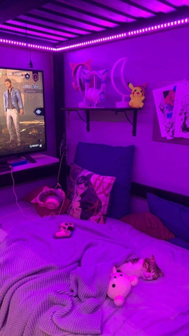 a bedroom with purple lighting and a flat screen tv on the wall above the bed