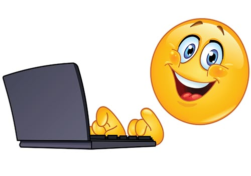 an emoticive smiley face using a laptop computer