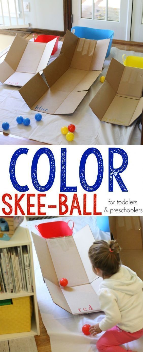 an image of a child playing with color and make - it - up balls in the playroom