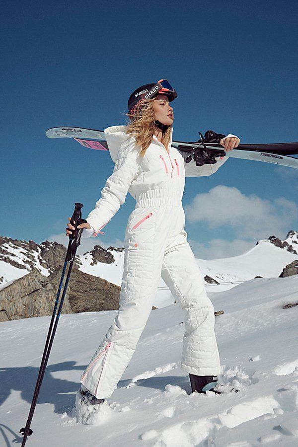 Made for the slopes, this complete ski suit features a fully waterproof design that keeps moisture out with a PrimaLoft insulated design to keep you warm while staying lightweight and locking out the cold. With a fitted silhouette and adjustable hooded neckline, you’ll stay extra cozy in cold temps, plus it’s equipped for everything you need for a ski trip from boot gaiters with gripper elastic and clips, easy-access external pockets and a ticket loop at interior sleeve pocket. * Fitted elastic Ski One Piece Suit, All White Snowboarding Outfit, White Snow Suit, Ski Style Women, Ski Town Outfits, Apres Ski Theme, White Ski Outfit, Snowboarding Fits, Cute Snowboarding Outfits