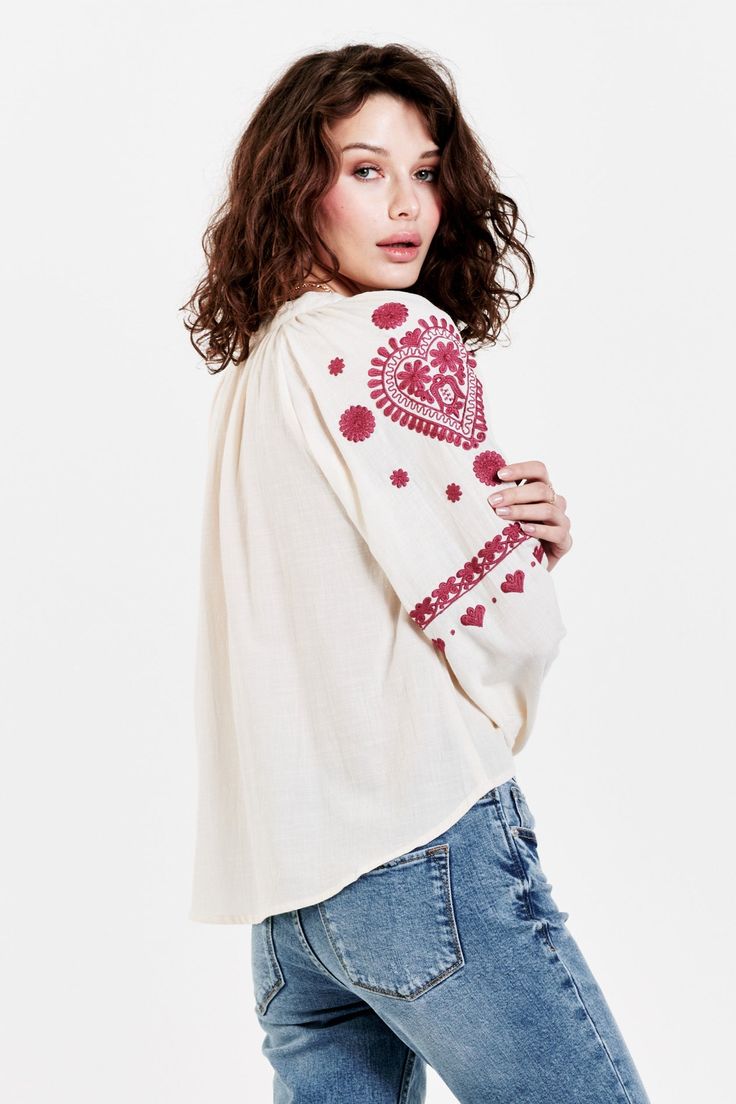 Embroidery detail top at front yoke & sleeve, puff long raglan sleeve in open vneck neck with dtm drawstring. Idyllic embroidery arts, romantic details your loving grace! Solid color woven on relaxed fit.Body length from HPS: 23", Sleeve length: 27 1/2", Bust: 40" (Size Small) 56% COTTON 44% VISCOSE Machine wash cold, Tumble dry low Imported Bohemian Tops With Floral Embroidery And Bishop Sleeves, Bohemian Tops With Embroidered Bishop Sleeves, Bohemian Top With Embroidered Bishop Sleeves, Cotton Blouse With Embroidered Bishop Sleeves, White Bohemian Top With Bishop Sleeves, White Bohemian Bishop Sleeve Tops, Relaxed Fit Tops With Embroidered Long Sleeves, Relaxed Fit Long Sleeve Tops With Embroidered Sleeves, White Tops With Floral Embroidery And Bishop Sleeves