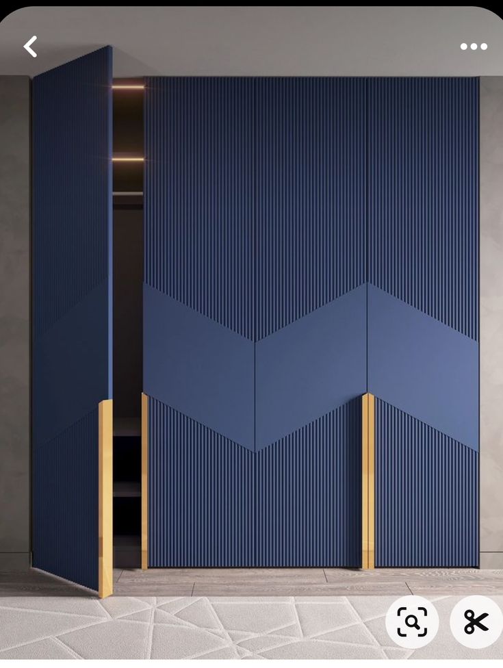 an open blue door with gold handles in a room