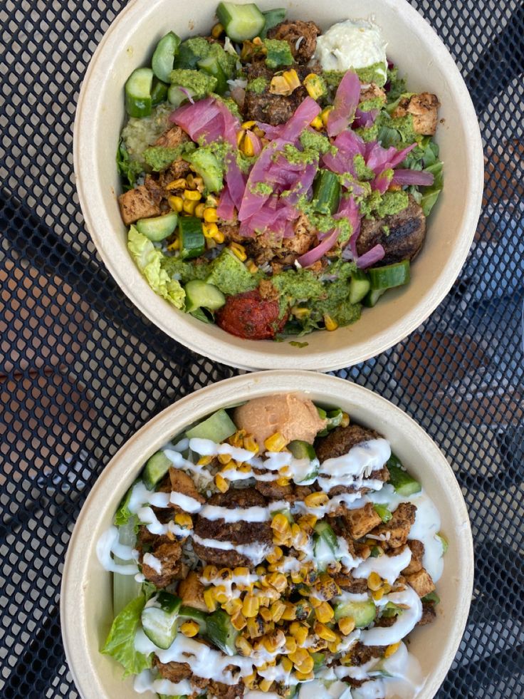 two bowls filled with different types of food