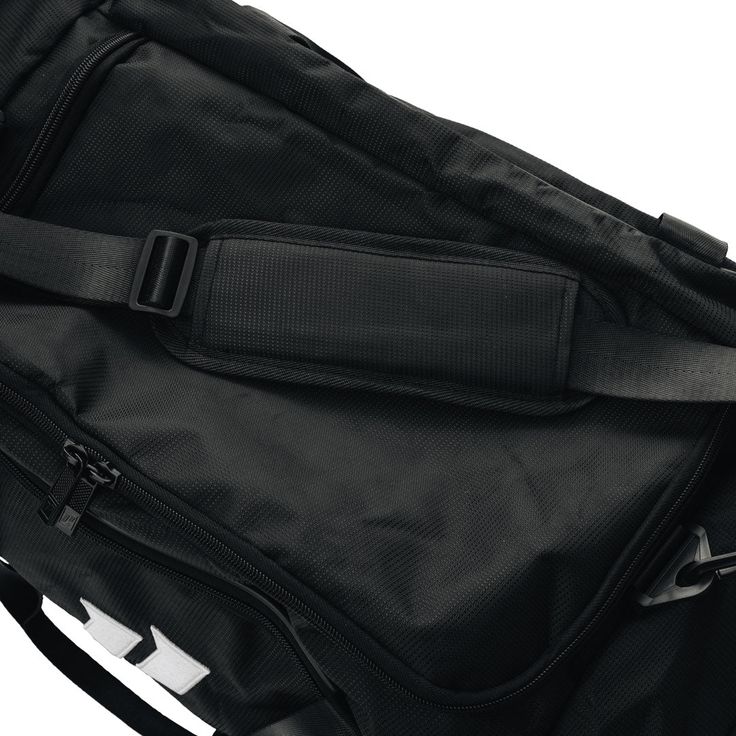 the back side of a duffel bag with straps