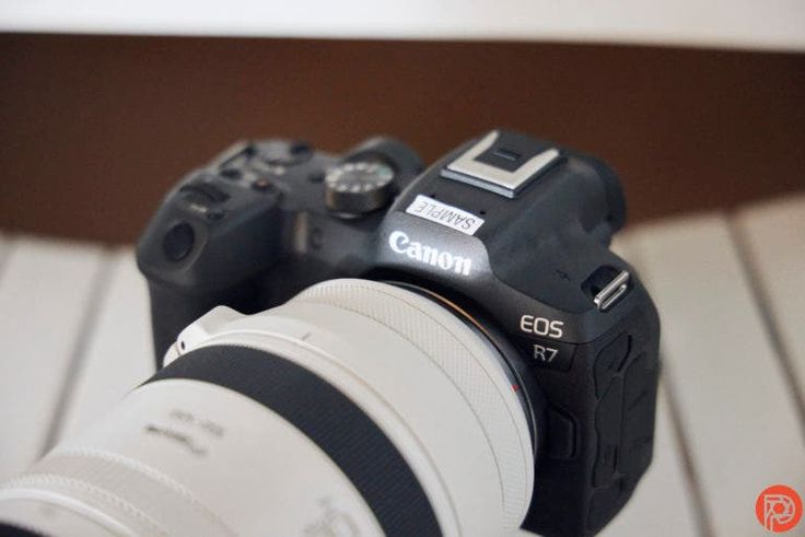 a canon camera sitting on top of a table