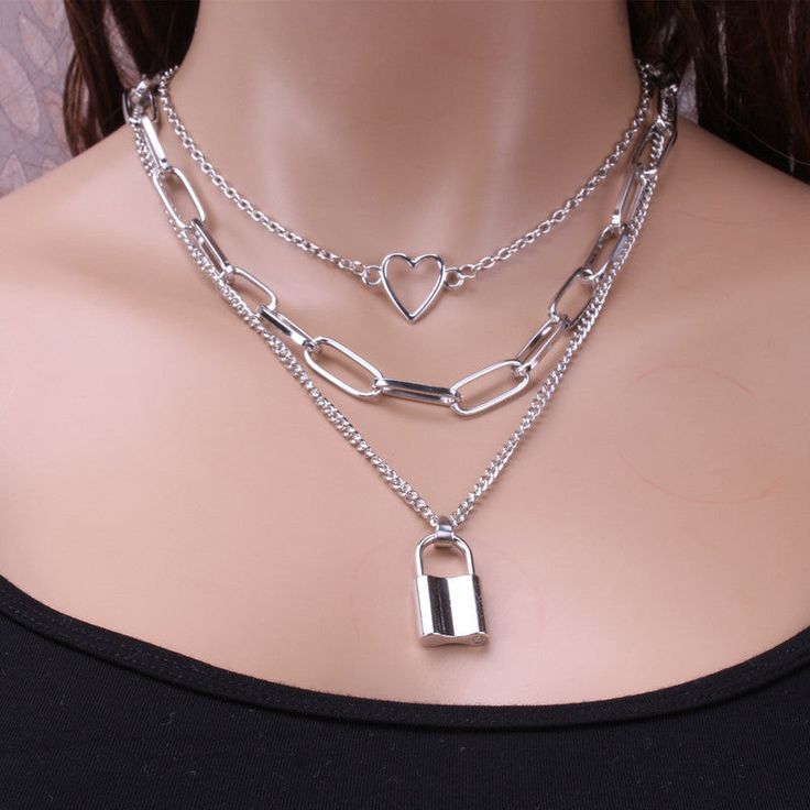 Beautiful triple necklace can be used for any occasion. Featured in silver and gold First Layer Chain Length: 19.69 in; Second Layer: 16.54 in; Third Layer: 14.57 in; Extension: 2.76 in; Lock Size: 0.59x0.98 in (approximate measurements) Material: Alloy **Colors may appear slightly different on-screen than in-person. Lock Chain Necklace, Triple Necklace, Layer Chain, Lock Chain, Layered Necklaces Silver, Lock Necklace, Layered Chains, Gold Necklace Layered, Layered Necklace