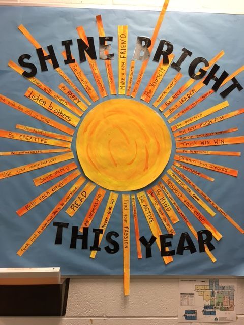 a bulletin board with the words shine bright this year