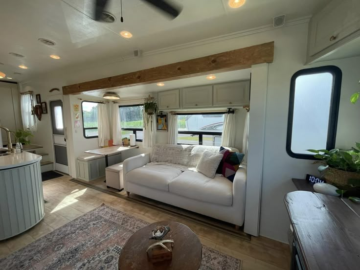 a living room and kitchen area in a mobile home