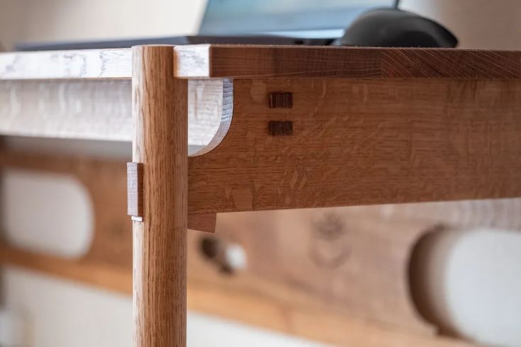 a close up of a wooden bed frame