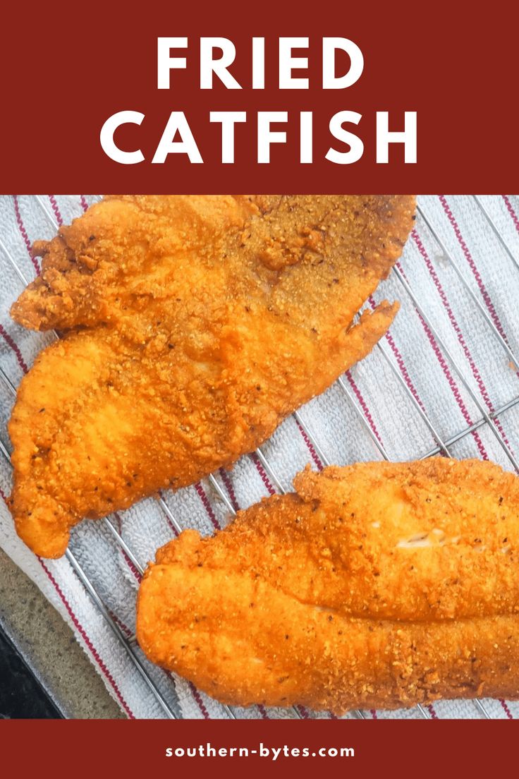 two fried fish fillets sitting on top of a towel