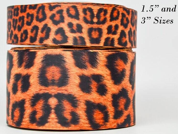 two rolls of brown and black leopard print ribbon on white background with measurements for each roll