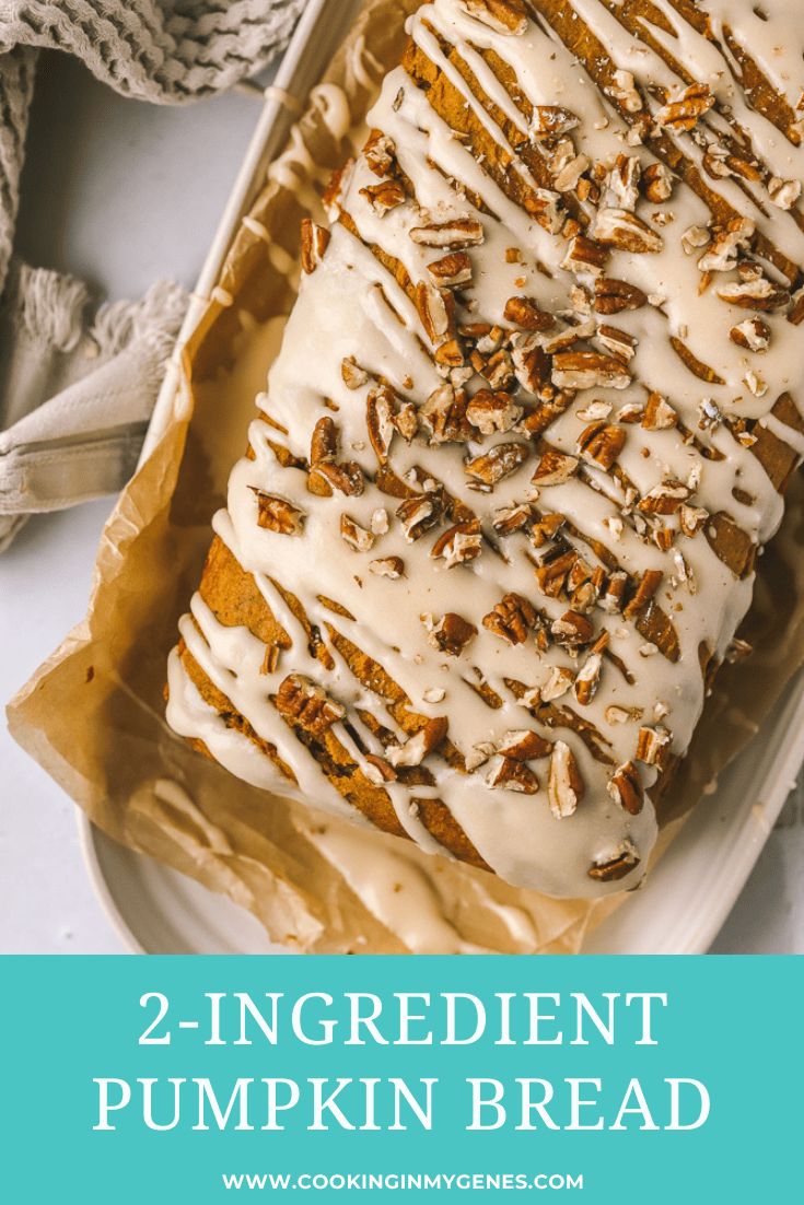 a loaf of pumpkin bread with white icing and pecans on top