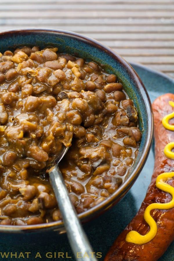 a bowl of chili and a hot dog on a plate