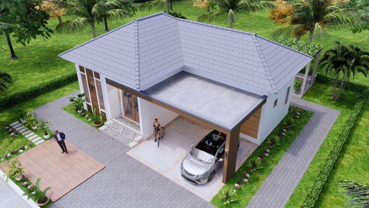 an aerial view of a house with a car parked in the driveway