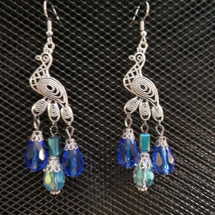 Antique Silver And Blue Peacock Earrings. Faceted Royal Blue And Iridescent Aqua Glass Crystal Teardrop Tail. Weight: 0.2 Oz/7 Grams Each (Heavy). 3.5 Inches/8.9cm From The Top Of The Ear Wire. Ear Wires Are Stainless Steel. Brand New, Never Worn Nwt. Handmade By Me, The Sparkliefiend! Trendy Jewelry Ideas, Peacock Earrings, Blue Peacock, Aqua Glass, Katniss Everdeen, Earrings Accessories, Jewelry Antique, Button Jewelry, Peacock Blue