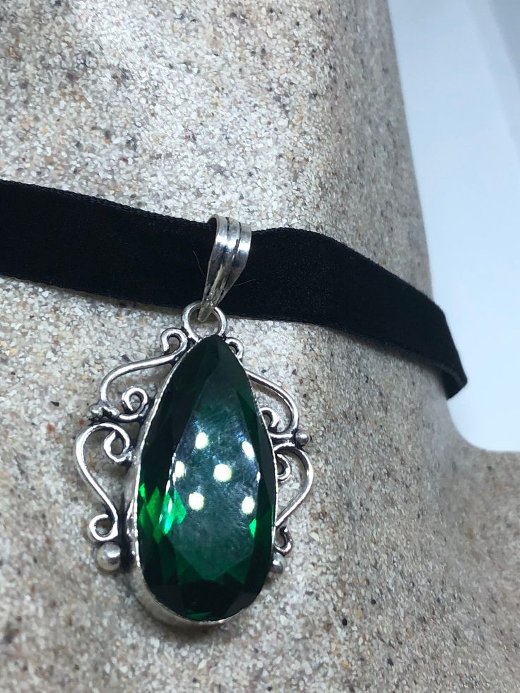 Handmade Vintage Green Glass  Crystal Choker Pendant
https://www.etsy.com/listing/644272871/handmade-vintage-green-glass-crystal Silver Emerald Pendant Necklace As Gift, Silver Emerald Necklace Gift, Silver Emerald Necklace As A Gift, Sterling Silver Jewelry For May Birthstone Party, Sterling Silver May Birthstone Jewelry For Party, Formal Green Engraved Necklace, Handmade Dark Green Emerald Jewelry, Vintage Sterling Silver Jewelry For Party, Vintage Sterling Silver Party Jewelry