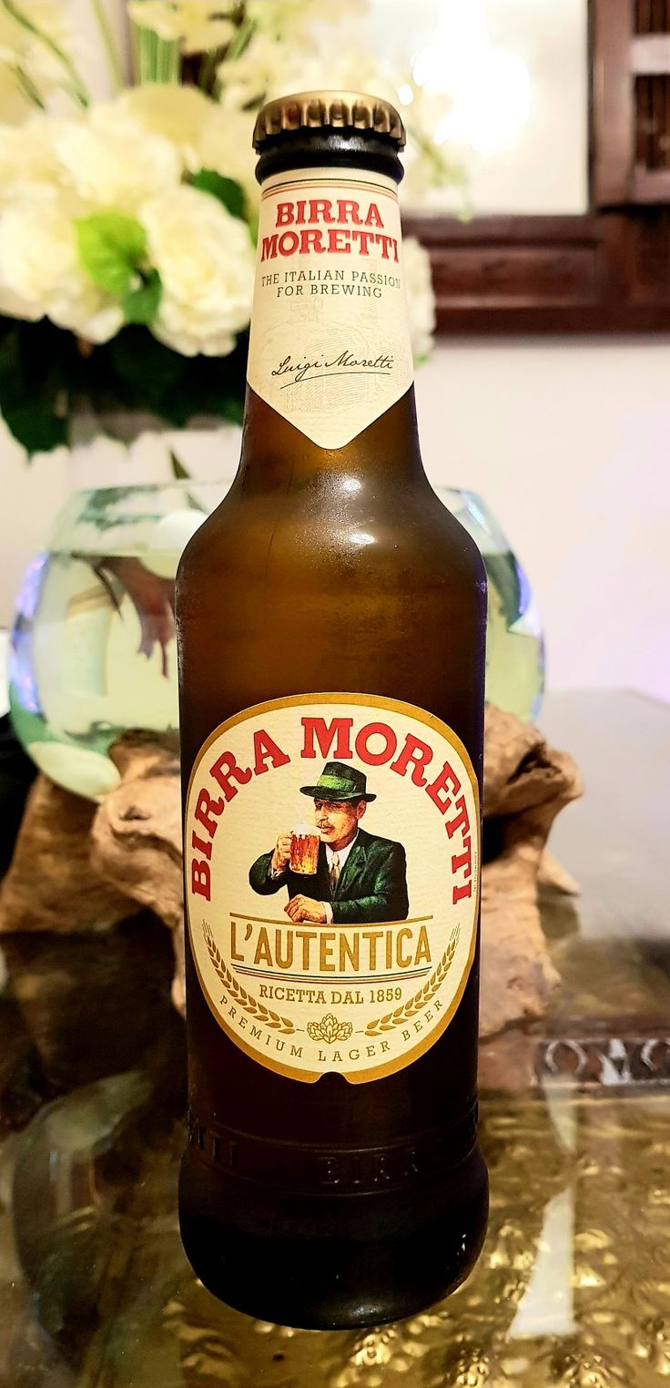 a bottle of beer sitting on top of a table