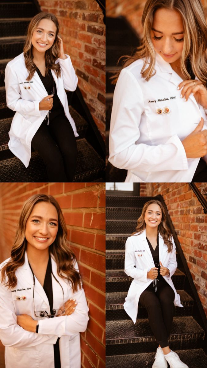 a woman in white lab coat sitting on steps with her arms crossed and smiling at the camera