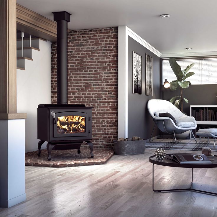 a living room filled with furniture and a fire place in the middle of it's wall