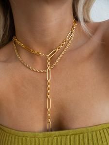 Gold Long Necklace With Figaro Chain, Formal Lariat Chain Jewelry, Yellow Gold Toggle Chain Necklace, Yellow Gold Link Lariat Necklace, Chic Gold-tone Lariat Necklace, Gold-tone Lariat Chain Necklace, Gold Lariat Necklace With Long Drop Chain, Gold Long Drop Chain Necklaces, Gold Long Drop Chain Necklace