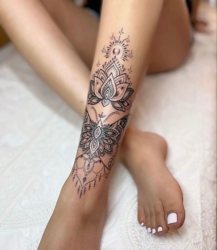 a woman's leg with a tattoo on it