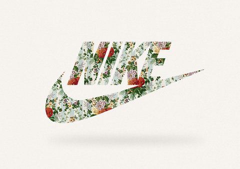 the nike logo is made up of flowers and leaves on a white background with red, green