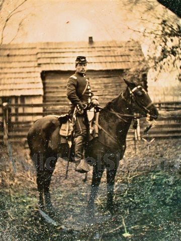 an old photo of a man riding on the back of a horse