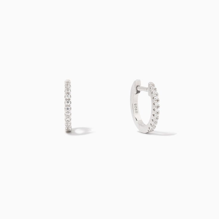 Elevate your small Sterling Silver or gold hoop earrings with some pavé details. Our Tiny Huggies not only add some extra shine to your ear stack, but they also make the perfect everyday layering piece. If you prefer a minimal look, pair these huggie earrings with our Simple Stud Earrings. For a statement stack, pair t White Gold Stackable Huggie Hoop Earrings, Classic Everyday Huggie Earrings With Pave Setting, Minimalist Hoop Earrings With Pave Setting, Everyday Pave Setting Huggie Hoop Earrings, Everyday Small Hoop Earrings With Pave Setting, Minimalist Everyday Hoop Earrings With Pave Setting, Minimalist Everyday Hoop Earrings With Pavé Setting, Minimalist Pave Setting Hoop Earrings For Everyday, Everyday White Gold Hoop Earrings With Pave Setting