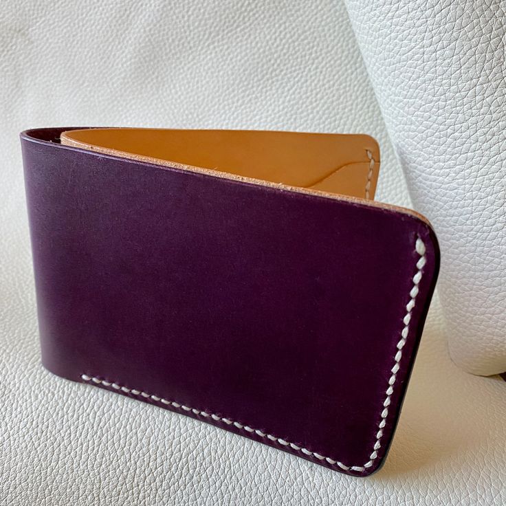 Full sized bifold wallets made for cards and cash. Buy it in natural and allow it to patina over time, or go with the classic brown and black. ** These wallets are made to order and take about a week to produce. ** Premium Italian leather from Conceria Walpier tannery Hand-sewn Approximate dimensions: 9.38”W x 3.25"T x 5/8" deep when closed Classic Brown, Veg Tan Leather, Bifold Wallet, Italian Leather, Eggplant, Card Wallet, Hand Sewn, Purple And Black, Tan Leather