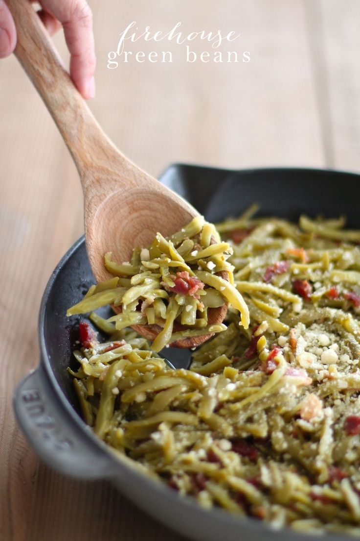 a pan filled with green beans and pasta