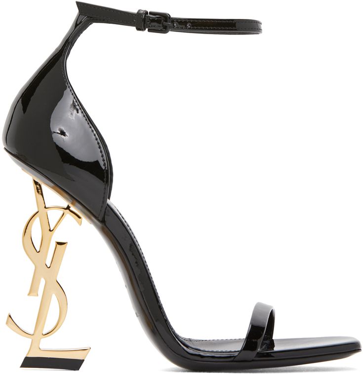 Patent calfskin heels in black. Open square toe. Strap at vamp. Adjustable pin-buckle ankle strap. Stiletto heel featuring logo hardware. Tonal leather sole. Gold-tone hardware. Approx. 4 heel. Supplier color: Black Ysl High Heels, Black Heels Prom, Black And Gold Shoes, Cute Black Heels, Gold Stilettos, Black Open Toe Heels, Luxury Heels, High Heels Black, Black Stiletto Heels