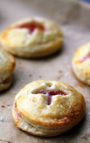 several small pastries sitting on top of a baking sheet