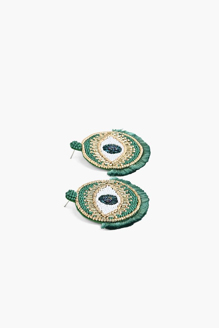 The Tahitian Evil Eye Earrings add a touch of glamour to any outfit. The evil eye design is said to protect the wearer from negative energy, and the emerald green beads are said to bring good luck. The earrings are lightweight and easy to wear, and the fringed detail adds a touch of fun. Made in beautiful shades of green, they will keep you looking fresh all through Fall. Style with black, white and shades of green to really see them pop. They are perfect for a night out or a beautiful vacation. Traditional Green Beaded Earrings For Party, Traditional Green Beaded Party Earrings, Green Evil Eye Round Beads Jewelry, Green Evil Eye Jewelry With Round Beads, Green Evil Eye Round Bead Jewelry, Green Evil Eye Bead Jewelry, Traditional Green Teardrop Beaded Earrings, Bring Good Luck, Evil Eye Design