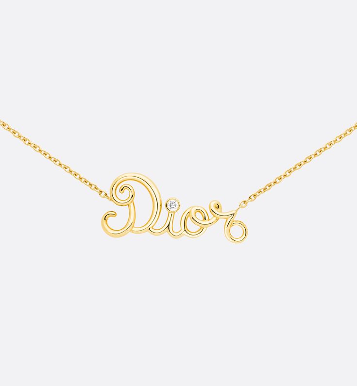 As if drawn by hand, the curves of the iconic pieces in the Dioramour Collection create joyful, graphic designs. Each curl twists like a strand of couture thread in a nod to the ateliers' savoir-faire.
Both a talisman and a symbol of belonging, the Dior name blossoms as a pendant.. Dior Necklace, Letter Necklace, Graphic Designs, Dior, Jewelry Necklaces, Thread, Yellow Gold, Graphic Design, Couture