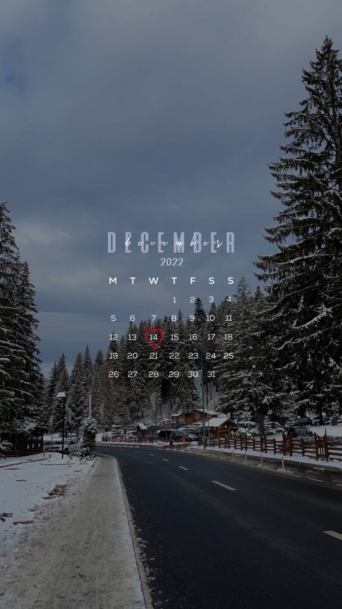 a calendar with the date december on it in front of snow covered trees and evergreens