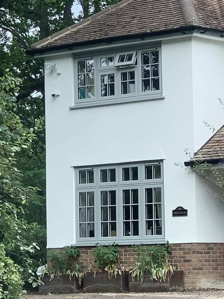 a large white house with two story windows