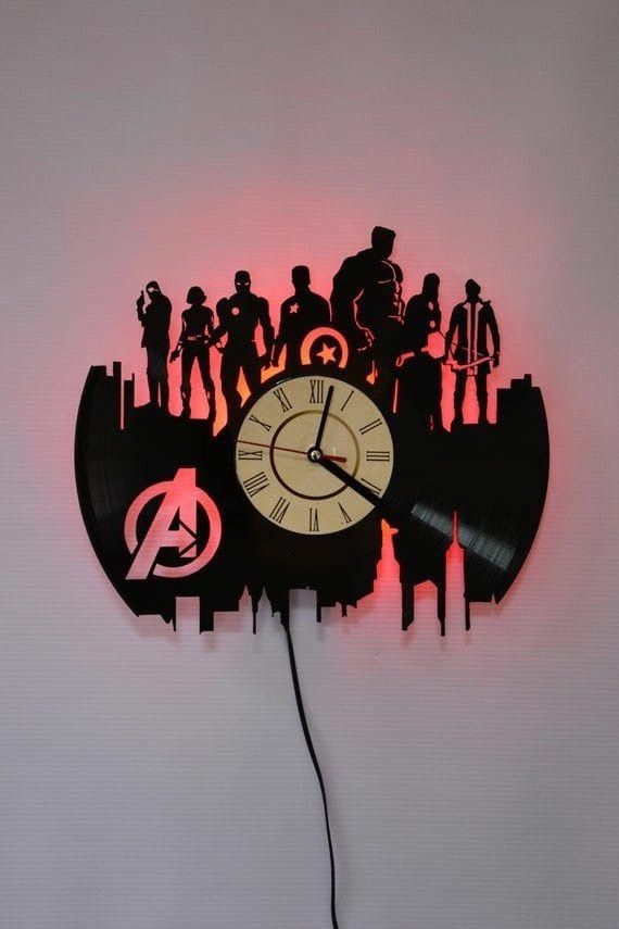 a clock with the avengers symbol on it