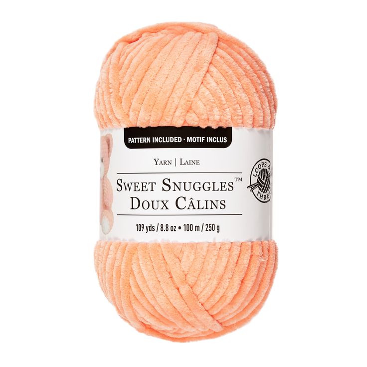 an orange ball of yarn with the words sweet snuggles in white lettering