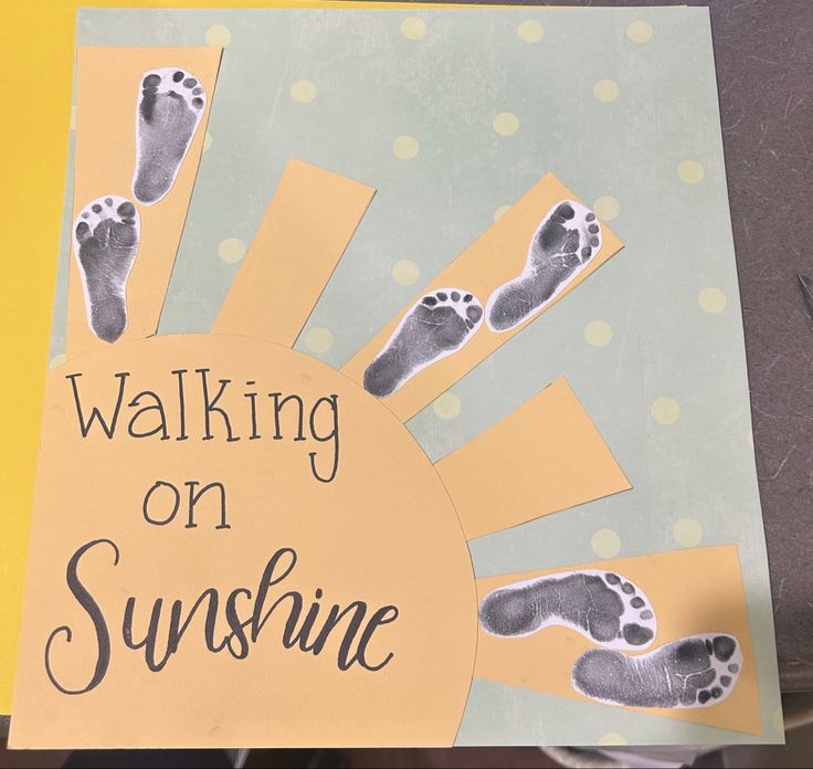 a sign that says walking on sunshine with footprints in the sun and polka dots around it