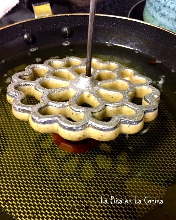 a waffle being cooked in a frying pan