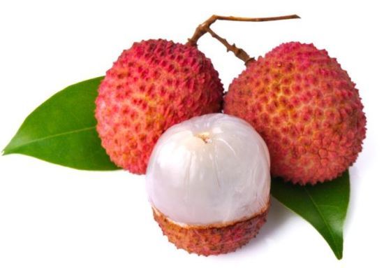 three fruits with green leaves sitting on top of each other