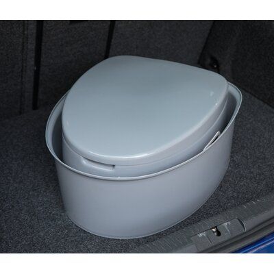 a white toilet sitting in the back of a car