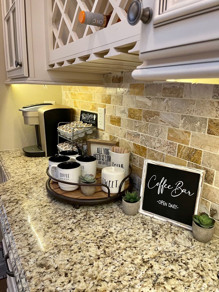 a counter top with some coffee cups on it