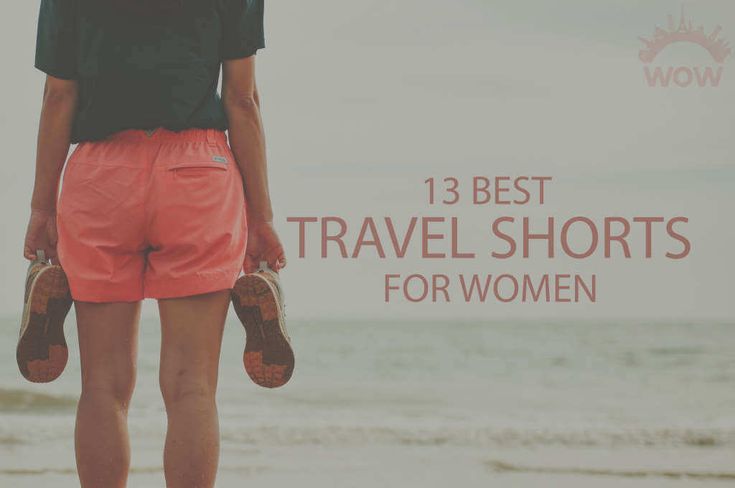 a woman standing on top of a beach next to the ocean with text overlay that reads 13 best travel shorts for women