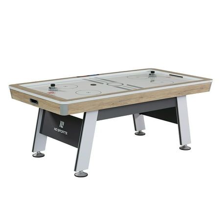 The MD Sports 7' Hinsdale Air Powered Hockey Table With Pusher and Puck Set features a LED scorer, timer, and arcade sound effects. This hockey table has real powered airflow and keeps the action going easily. The airflow is powered by a premium blower fan, providing maximum airflow across the entire playing surface. This table has heavy-duty aprons, reinforced top rails, and sturdy legs. Two pucks and two pushers are included with this game table. This premium air-powered hockey table by Medal Basement Man Cave, Air Hockey Tables, Hockey Table, Air Hockey Table, Air Hockey, Indoor Games, Rec Room, Sound Effects, Play Area