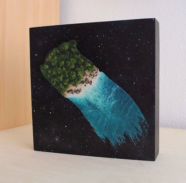 a painting of a green object on a black box with stars in the sky behind it