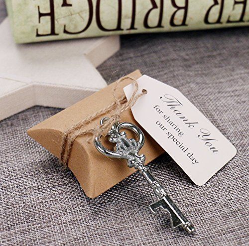 a key is sitting on top of a piece of brown paper with a tag attached to it